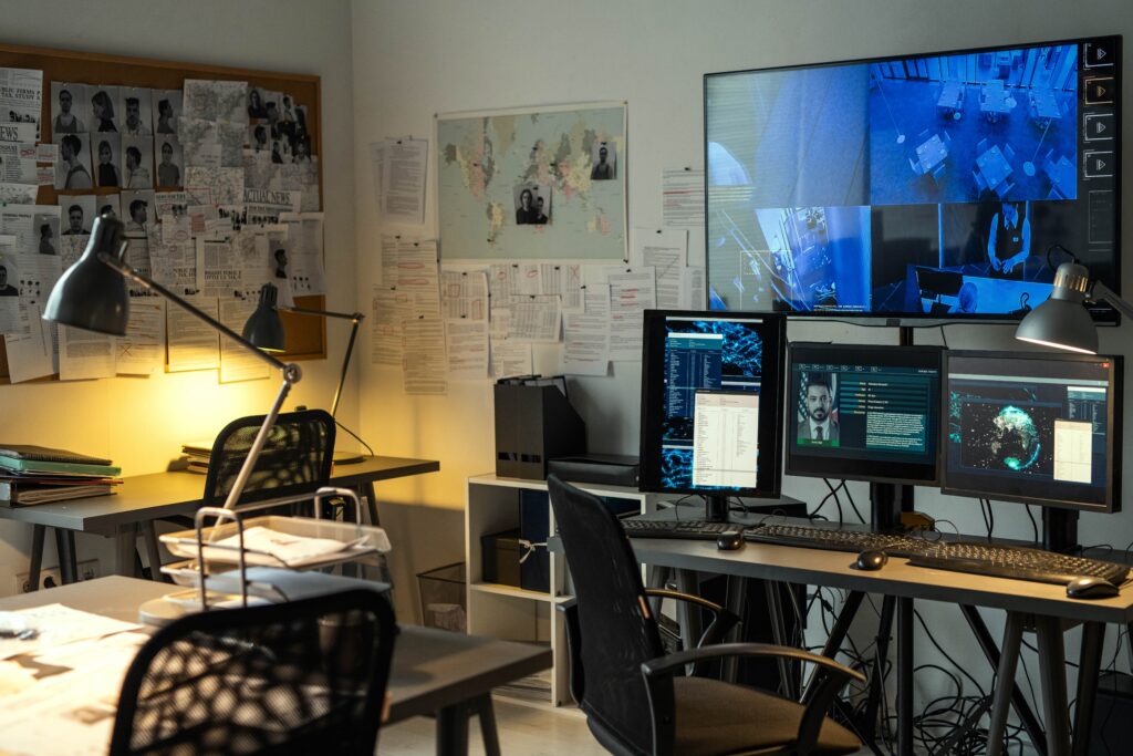 security surveillance room with tv and monitors